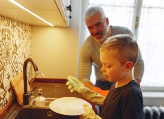 Boy doing the dishes