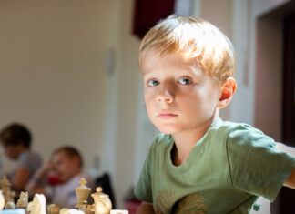 kid playing chess