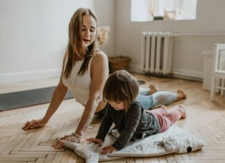 Parent and kid doing yoga