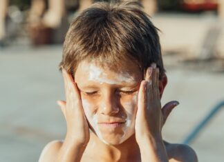 Boy wearing sunscreen