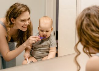 Baby brushing teeth
