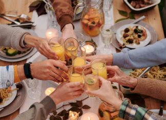 People clinking glasses together