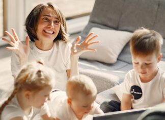 Mother having a mental breakdown behind her children