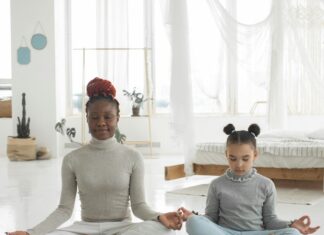 mother and daughter meditating