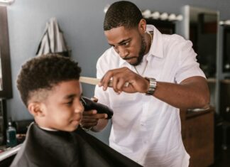 Man giving boy a haircut