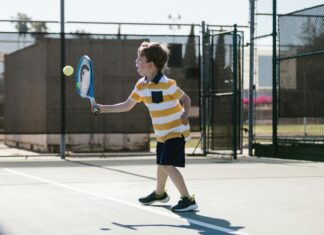 Boy playing tennis