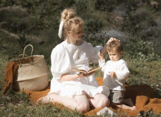 A Woman with a Kid Having Picnic on the Grass