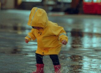 Child Jumping in Puddle