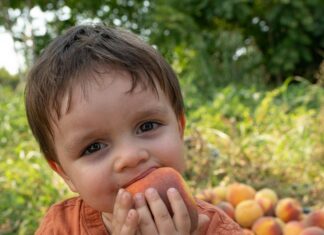 Boy Eating Peach