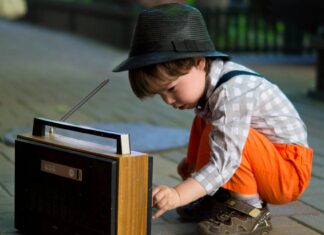 Boy Tuning Transistor Radio