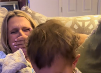 Baby getting up and dancing to the music