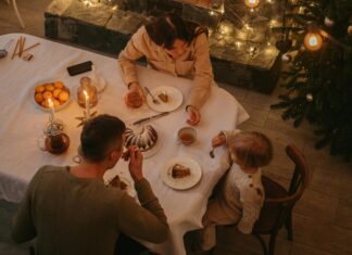 High Angle Shot of a Family on a Dinner Table during Christmas Season