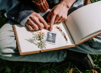 Woman Sitting Crossed Legged and Making a Scrapbook