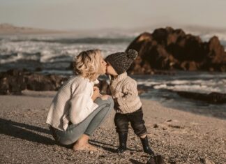 Photo Of Woman Kissing Toddler
