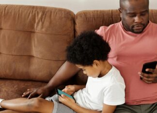 Father and Son Relaxing on a Sofa