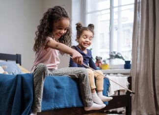 Kids Playing with White Cat