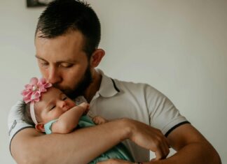 Photograph of a Father Kissing His Daughter