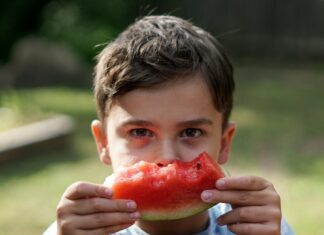 Kid eating watermelon